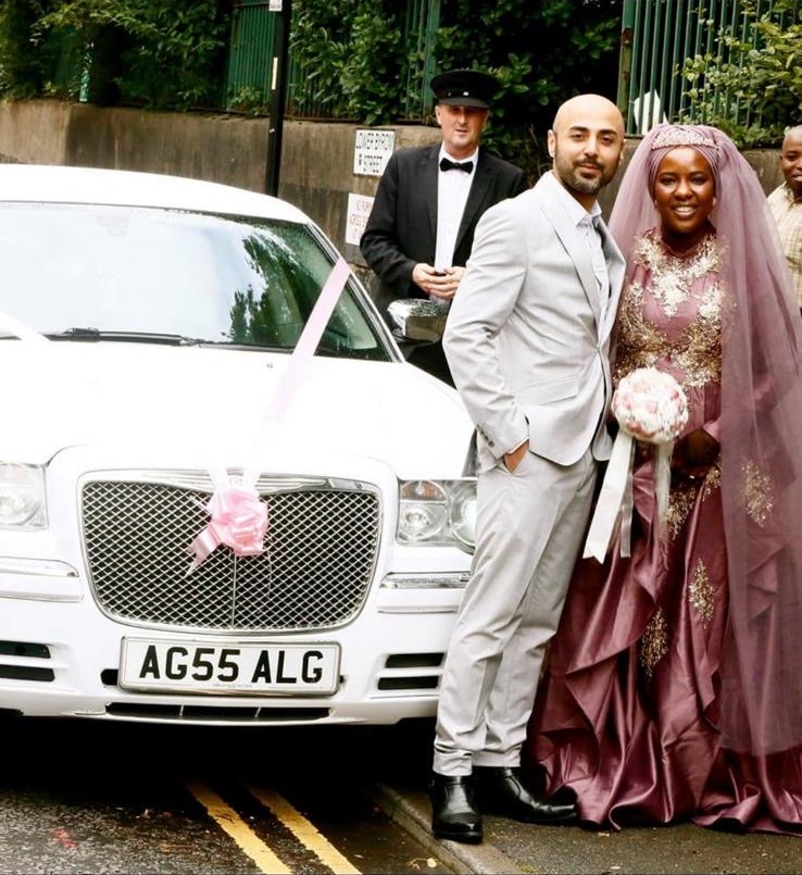 New wedding photo beside the white Baby Bentley